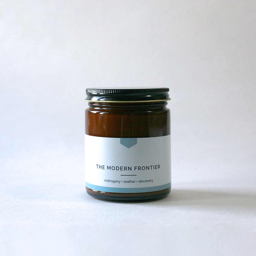 
                  
                    THE MODERN FRONTIER 9 oz Amber Glass Soy Candle - COLLAB - Vacant Wheel
                  
                